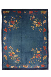 Antique Chinese Art Deco Walter Nichols rug, 138x110 inches, featuring elegant coral and gold floral sprays at each corner on an azure blue field, framed by a coordinating border.